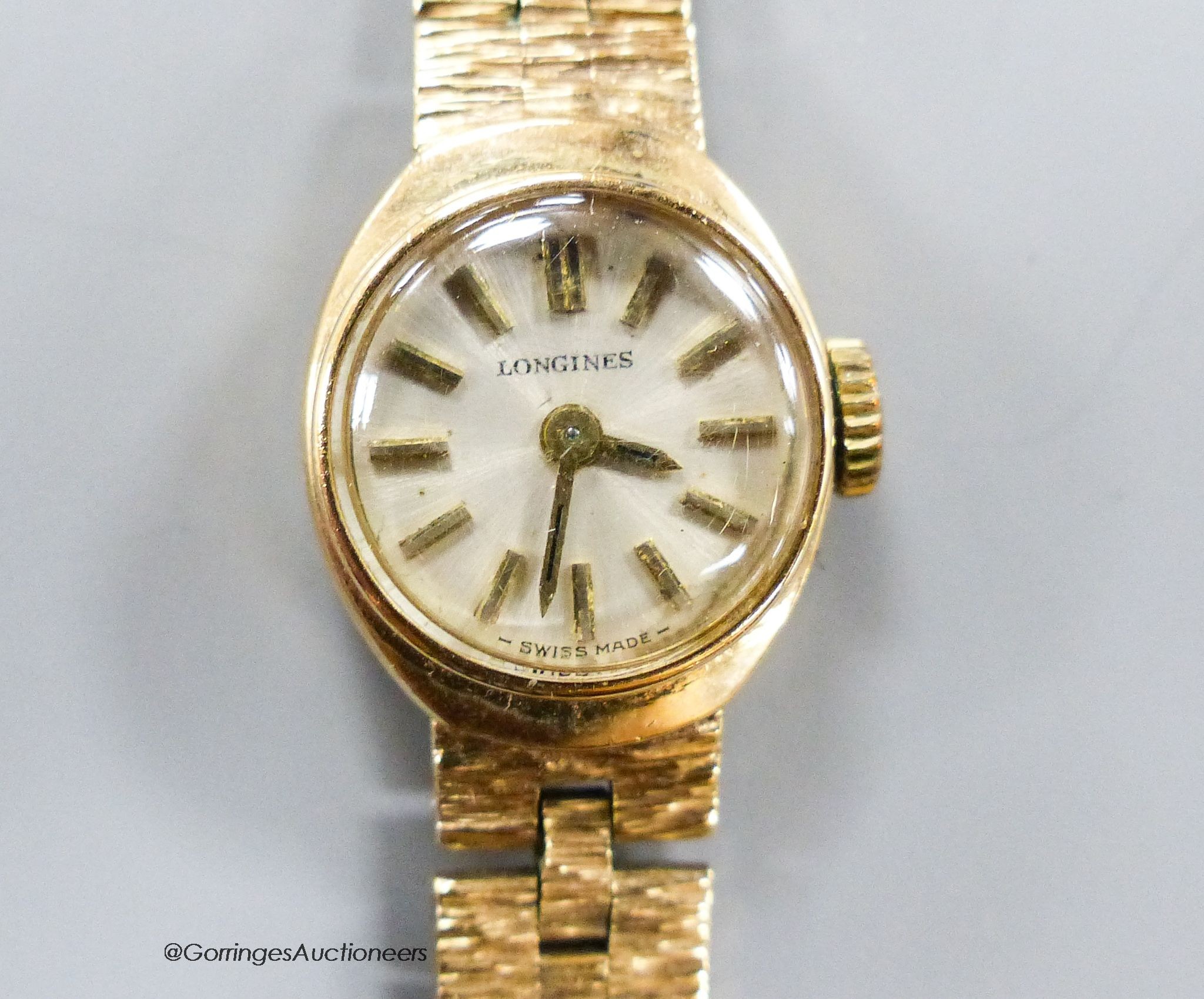 A lady's 9ct gold Longines wristwatch, overall 18.5cm, gross 18.5 grams.
